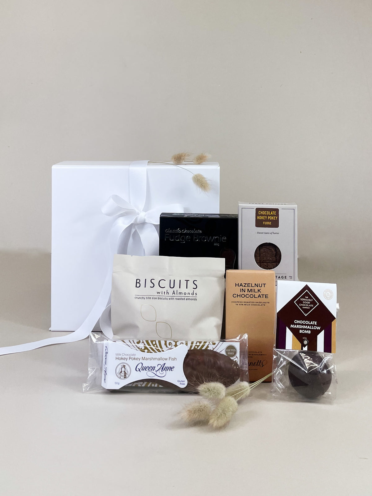 A Wee Surprise Gift Box filled with New Zealand chocolate, fudge and artisan sweets, beautifully presented as a thoughtful gift.