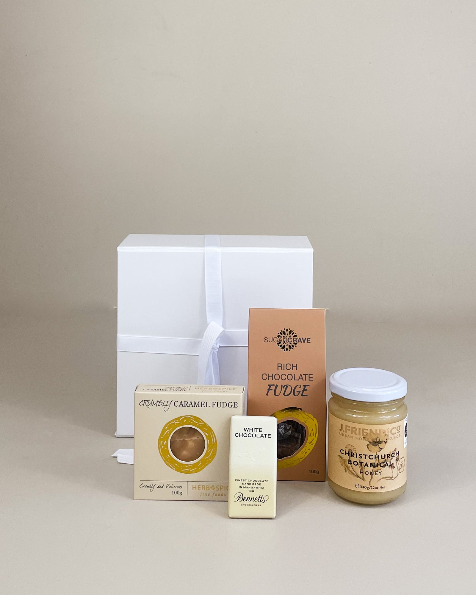 A Wee Surprise Gift Box NZ with honey, fudge and sweet treats beautifully packaged for gift delivery in New Zealand