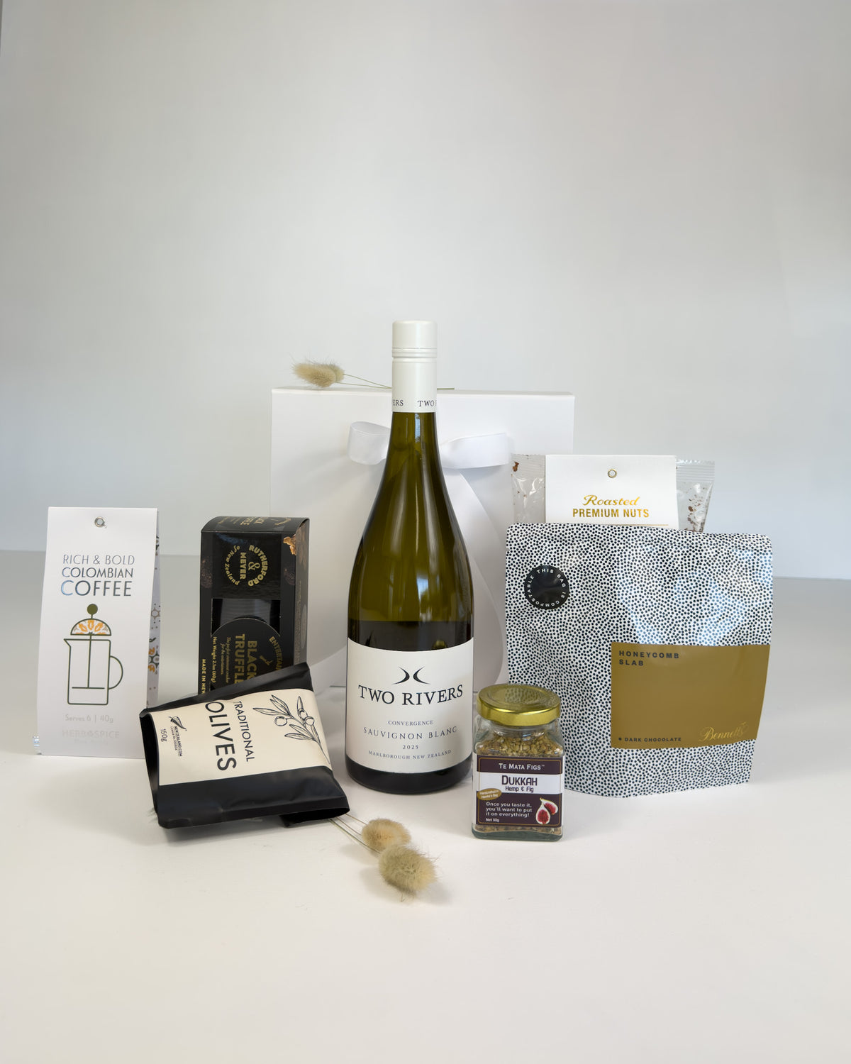 espoke New Zealand wine and food gift box featuring premium South Island wine and NZ-made artisan gourmet treats, beautifully presented for gifting.