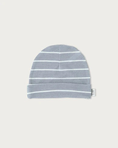 Newborn baby wearing the Babu Merino Baby Beanie made from 100% extrafine merino wool, soft breathable and warm infant hat with folded cuff for a secure comfortable fit.