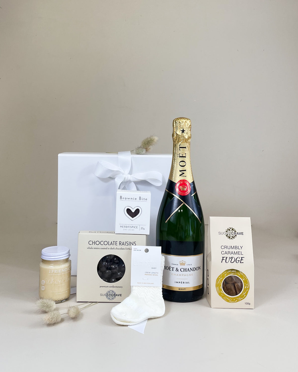 New baby gift basket with Moët & Chandon Champagne, Merino newborn socks and treats 
