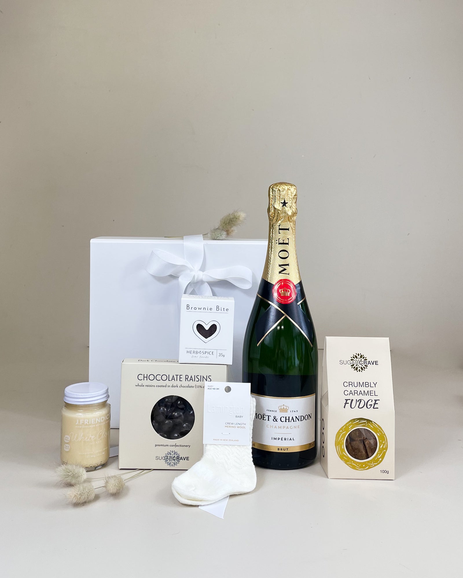 New baby gift basket with Moët & Chandon Champagne, Merino newborn socks and treats 