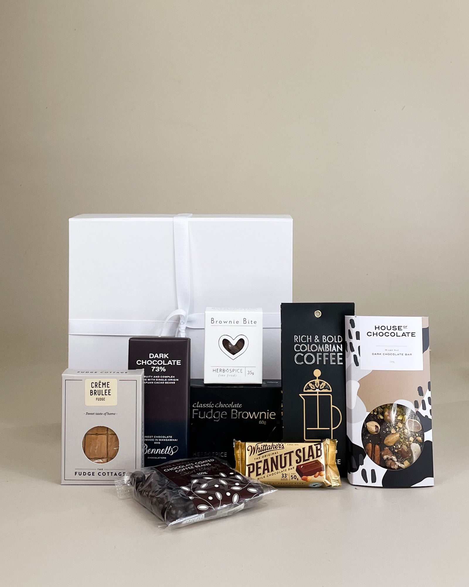Luxury coffee and chocolate gift hamper with premium chocolates, coffee fudge, chocolate-coated coffee beans, and gourmet treats beautifully presented in a gift box.