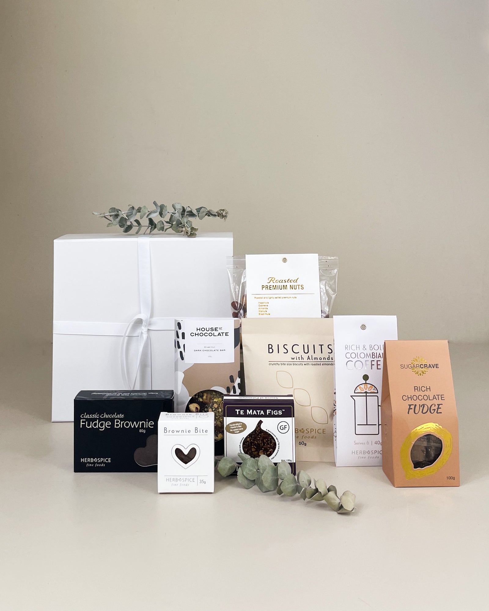 Sympathy gift box with artisan creamy fudge, gourmet fig cake, sweet treats, premium snacks, and optional elegant embossed porcelain vase, beautifully packaged for thoughtful condolence gifting in New Zealand.