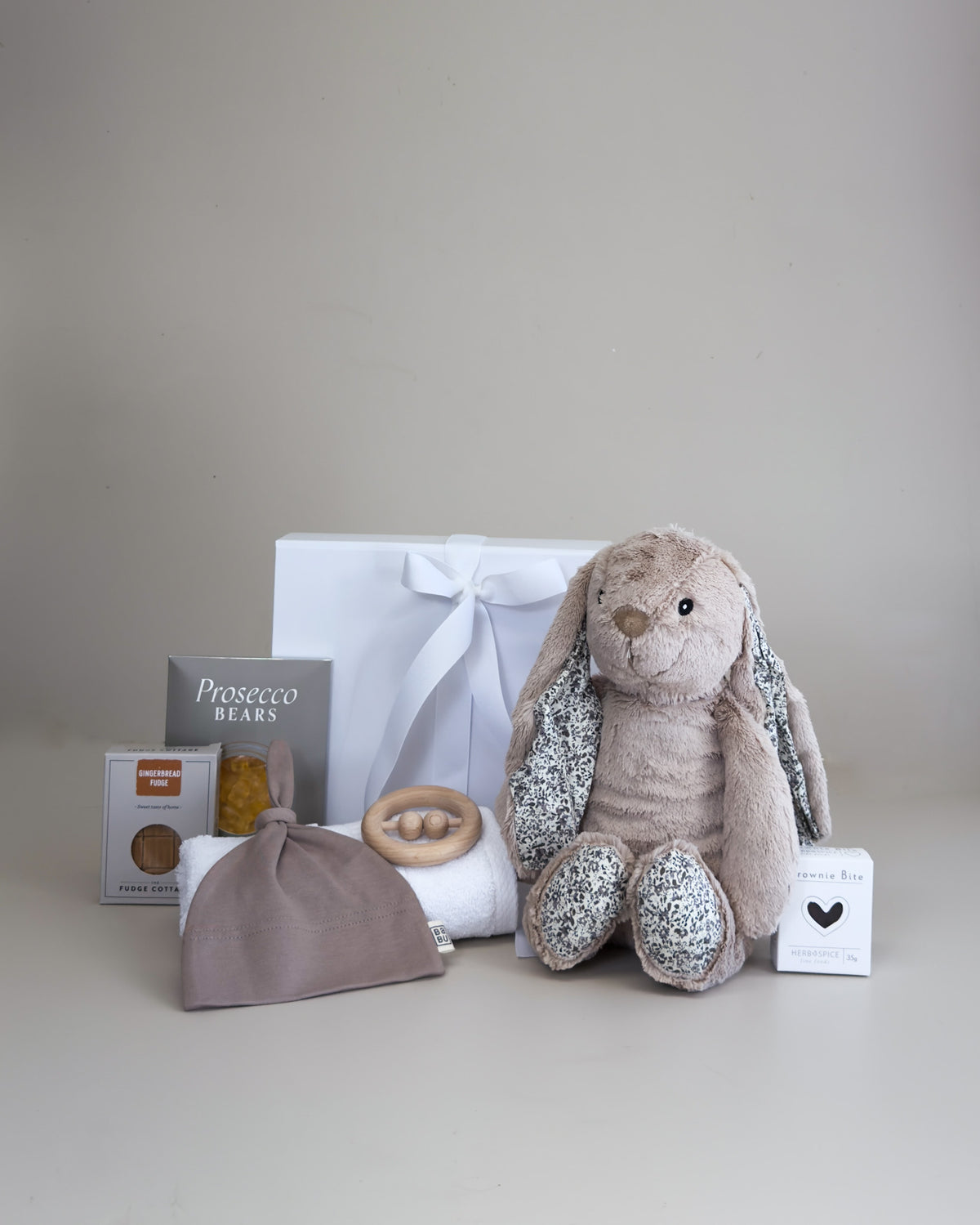 Deluxe baby boy newborn gift box with bunny, cotton beanie, teething toy and treats for new parents