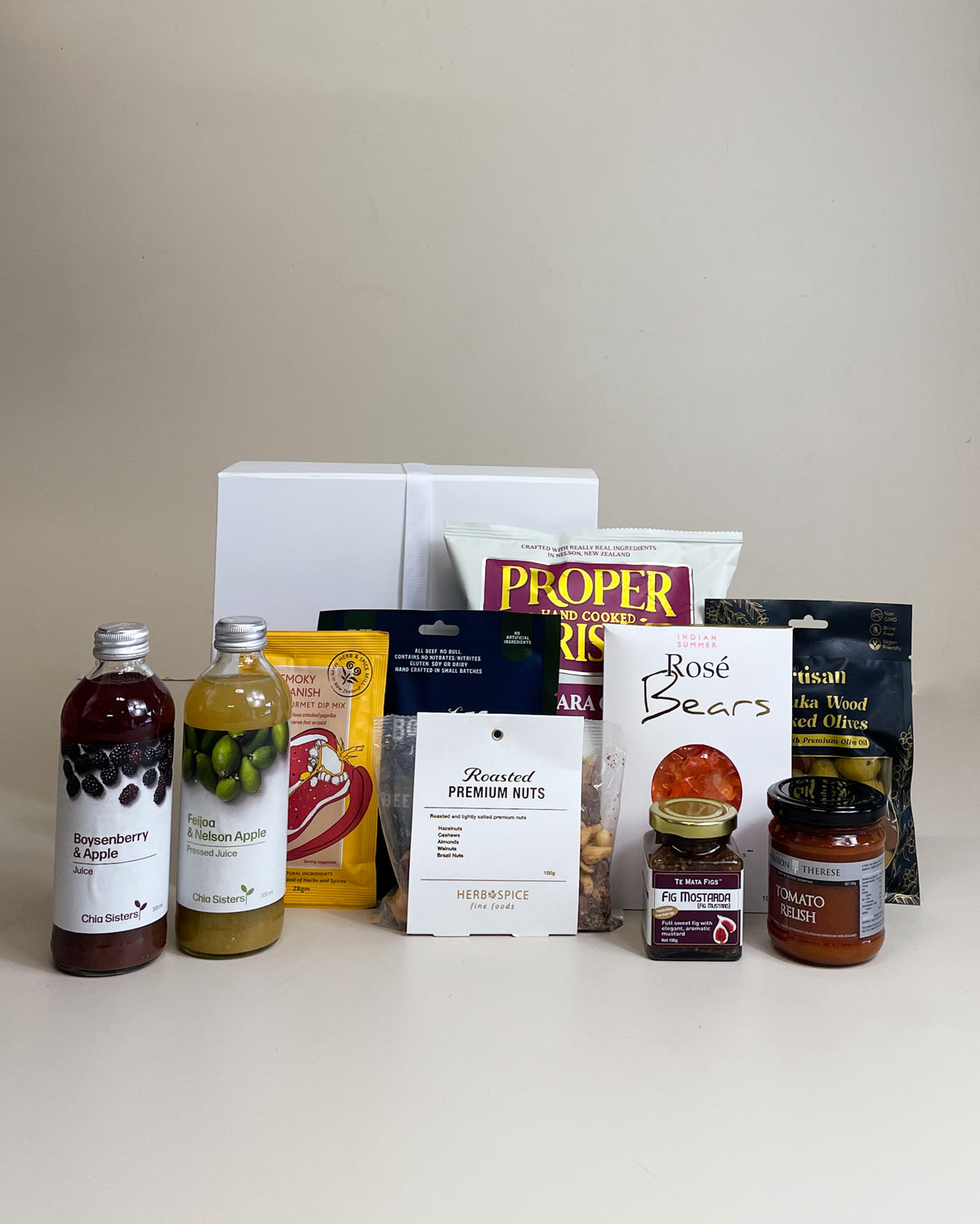 Deluxe dairy free gift box NZ with gourmet vegan snacks crisps fig relish juice nuts and sweet treats