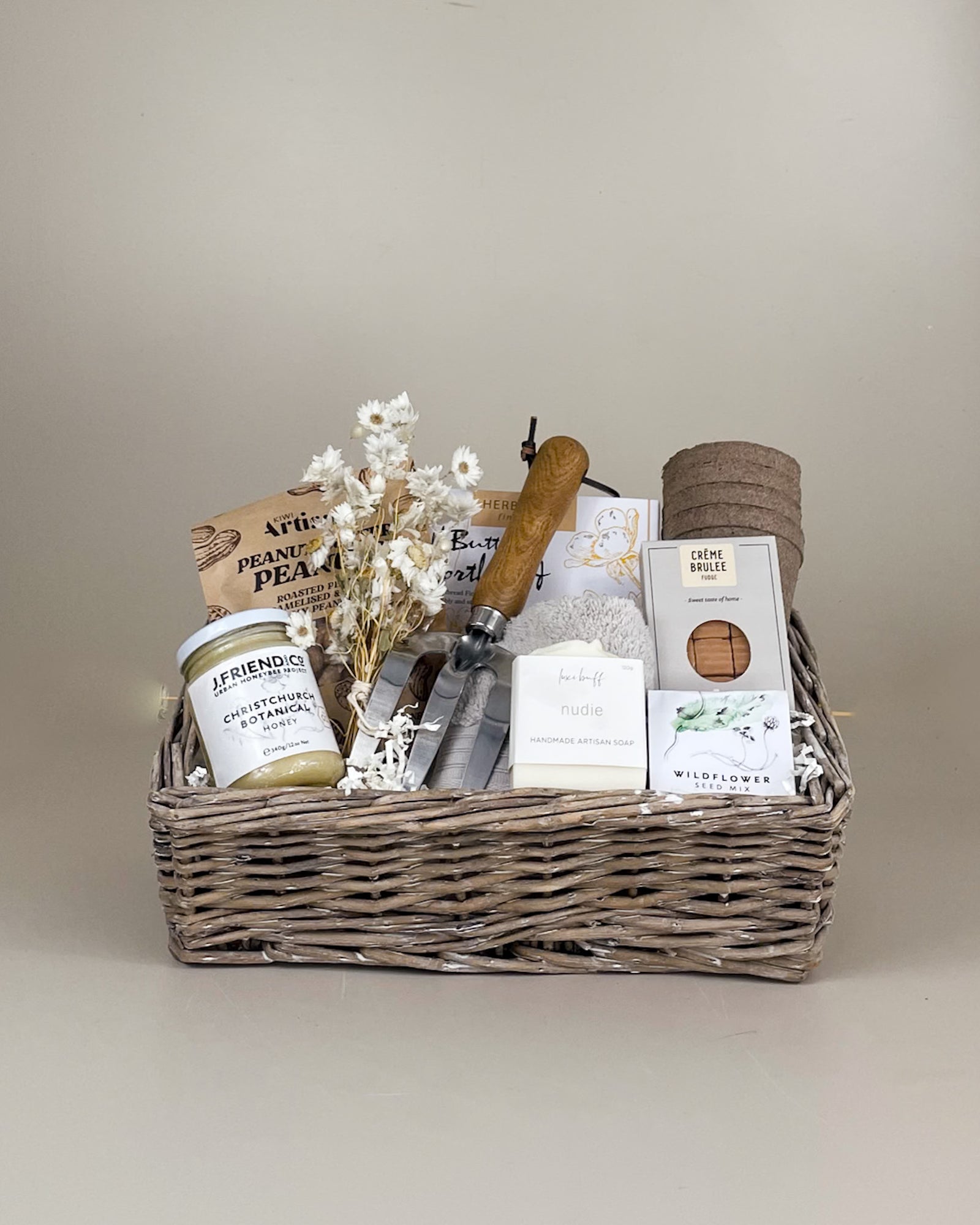 Garden gift basket NZ with seeds, garden fork, seedling tray, honey, nuts and natural soap