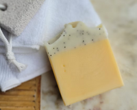 Natural organic New Zealand made uplifting body soap with lemon, petitgrain and poppy seeds for gentle exfoliation and refreshed skin.