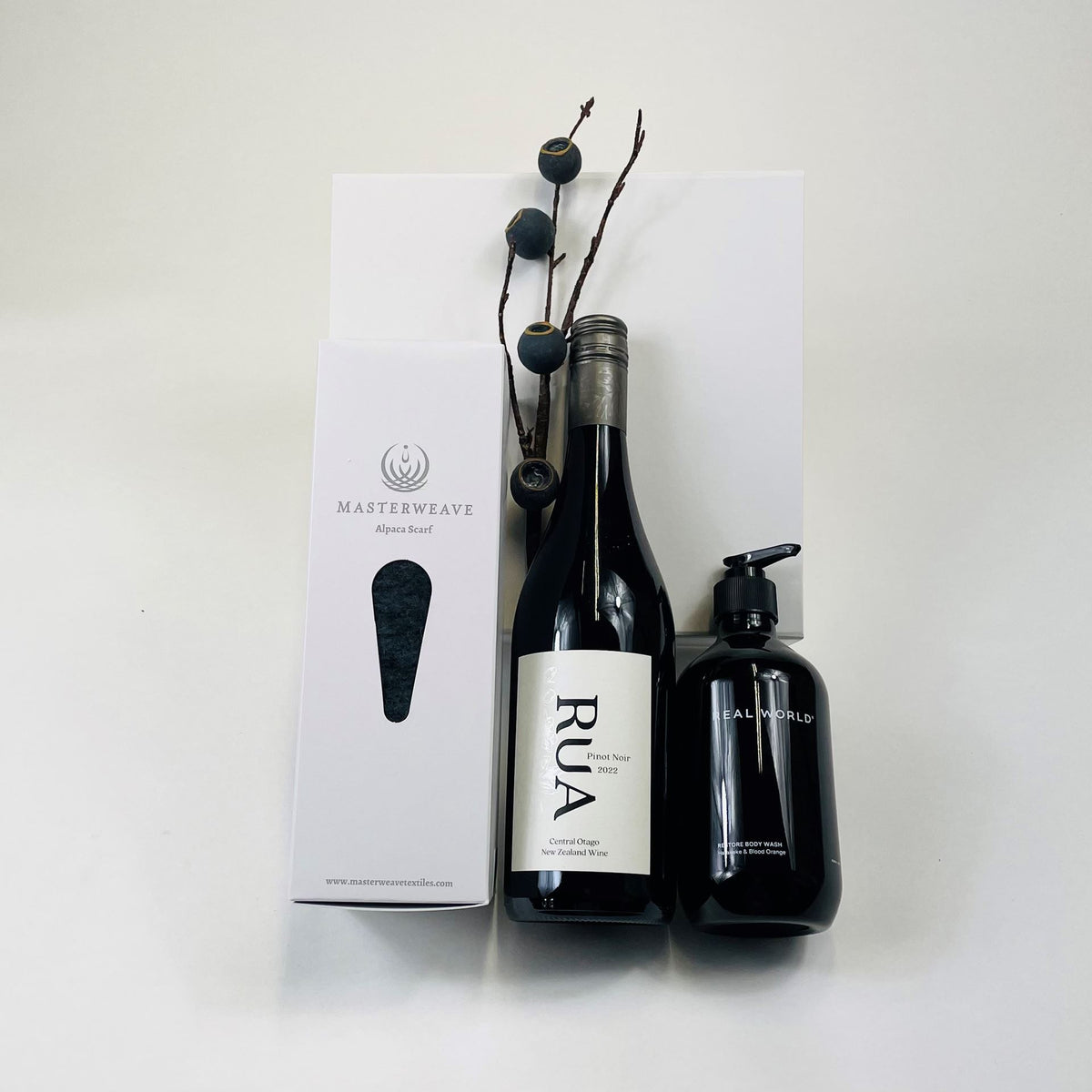 Luxury New Zealand merino wool scarf, wine and Real World body lotion in a premium gift box, perfect for men or women.