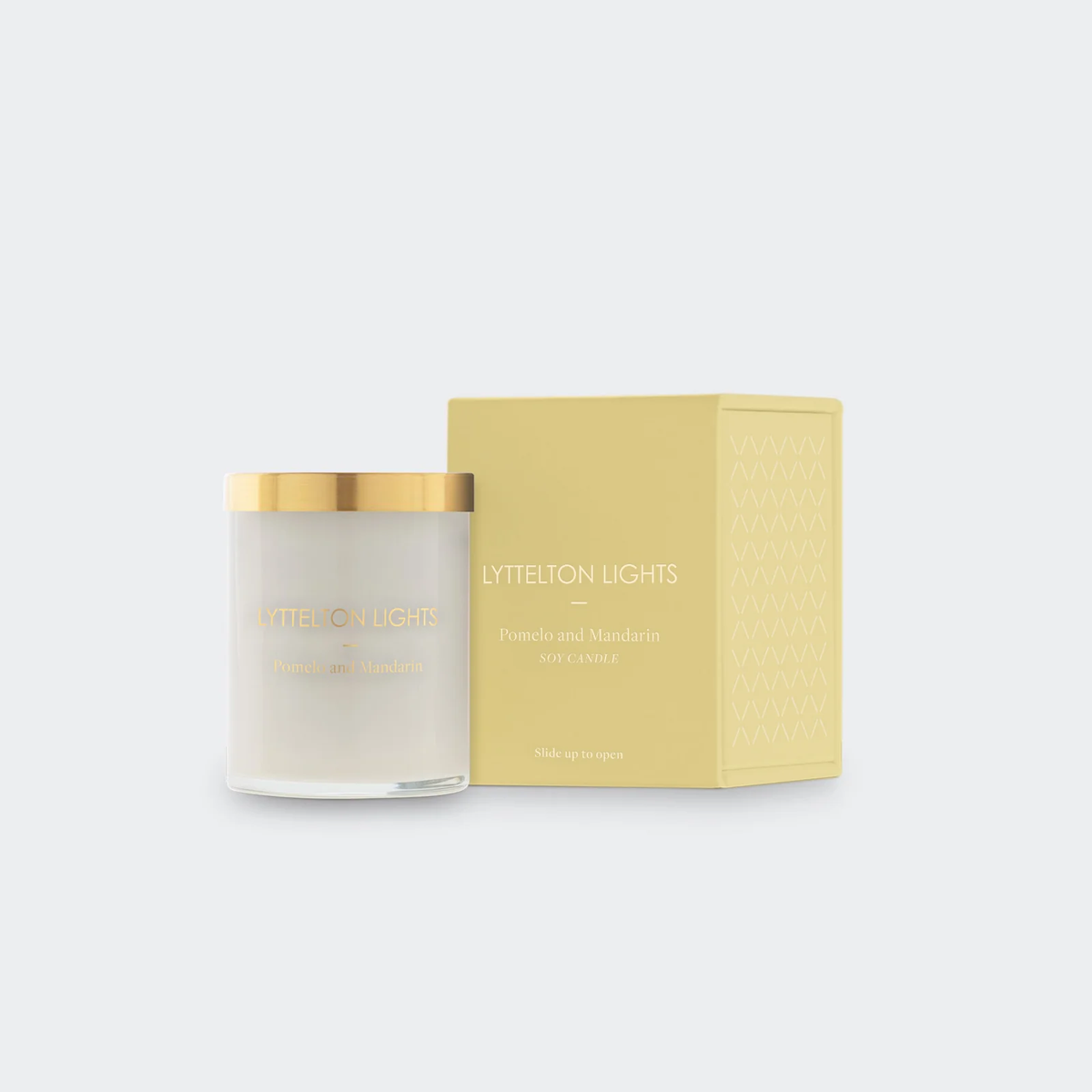Alt text: Handcrafted soy wax candle in a simple elegant container, made with natural soy wax and a braided cotton wick, offering a thoughtful gift for any occasion.
