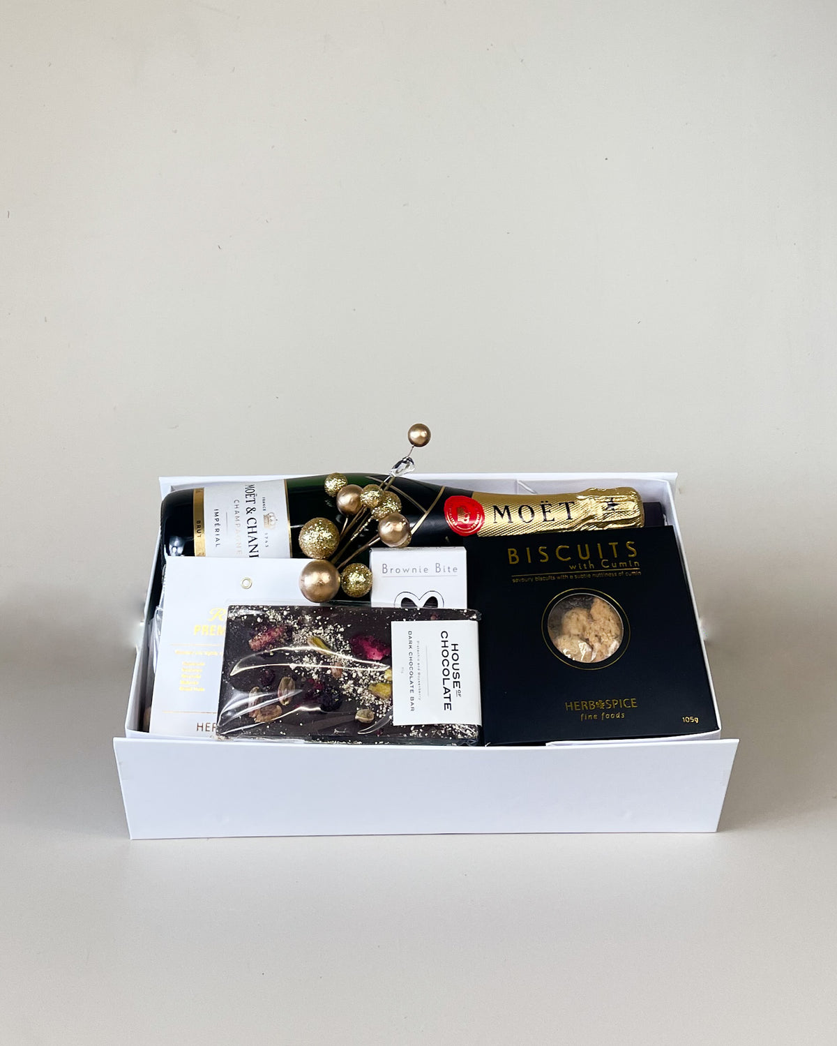Luxury Moët & Chandon champagne gift box featuring premium champagne, gourmet treats, and a handwritten gift card for celebrations, birthdays, Mother’s Day, and special occasions.