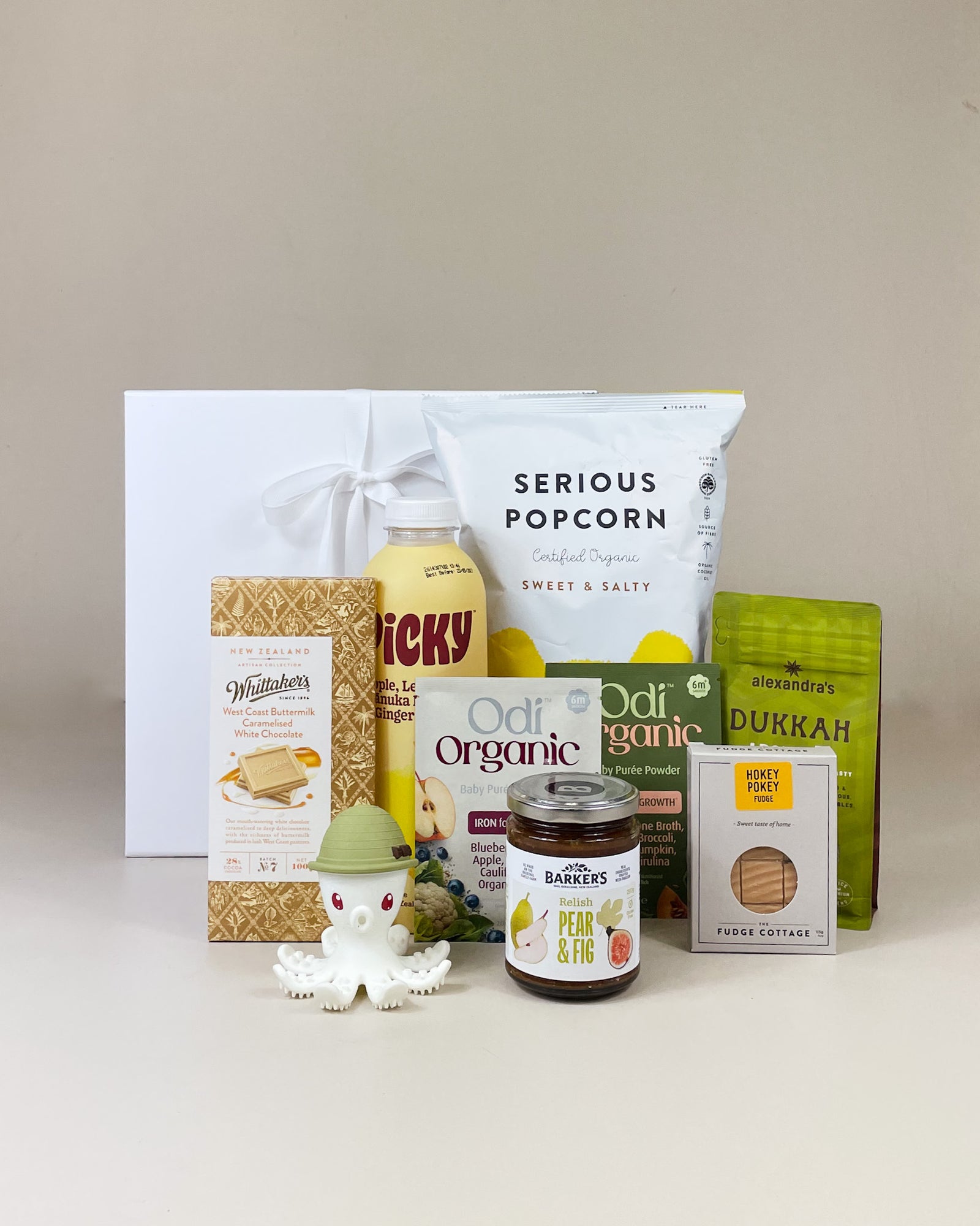 New Parents Gourmet Gift Box with NZ artisan food treats and baby teething toy, beautifully presented with ribbon