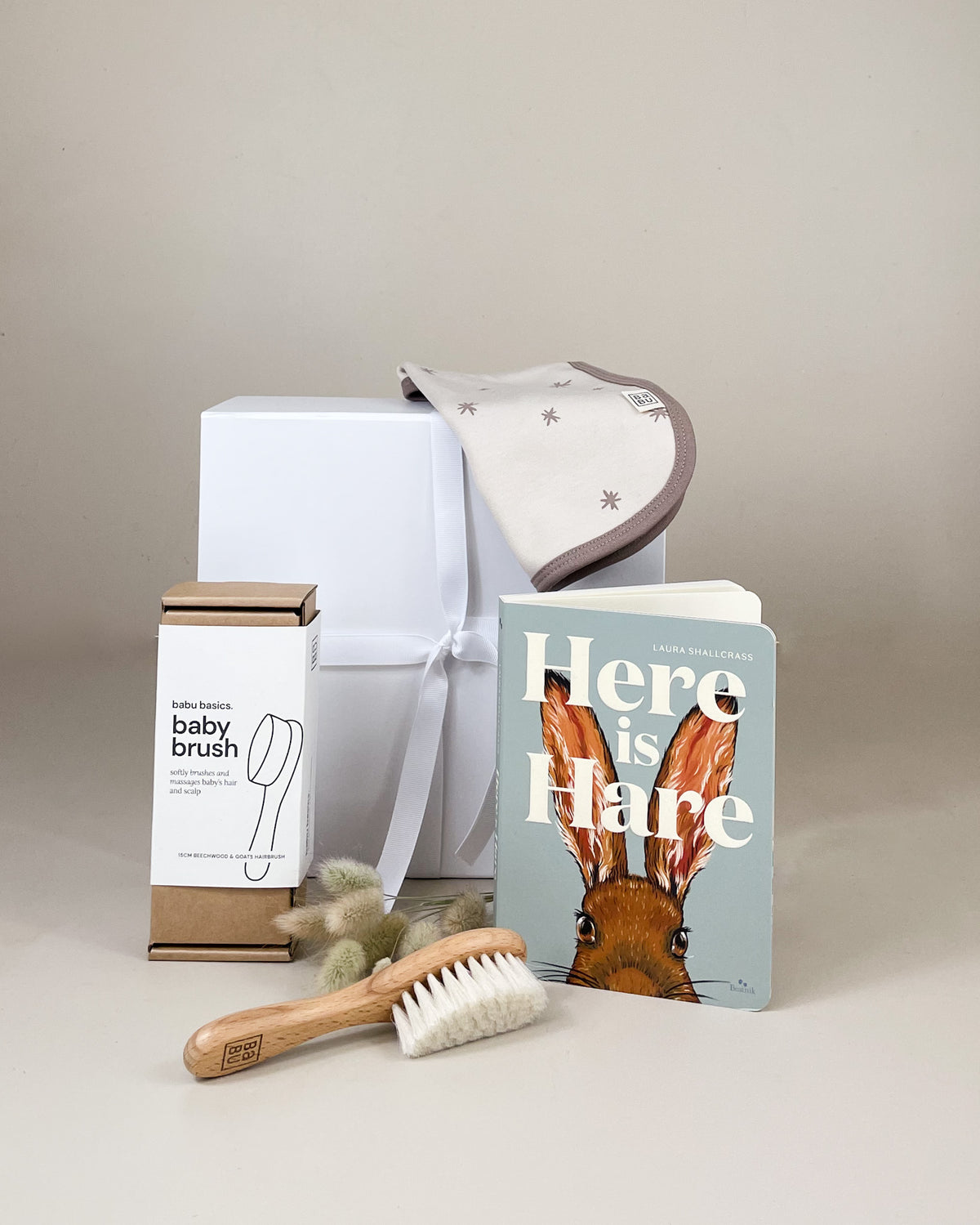Newborn Keepsake Baby Gift Box NZ with rabbit baby book, bib, and choice of merino socks or baby brush, beautifully presented newborn gift box