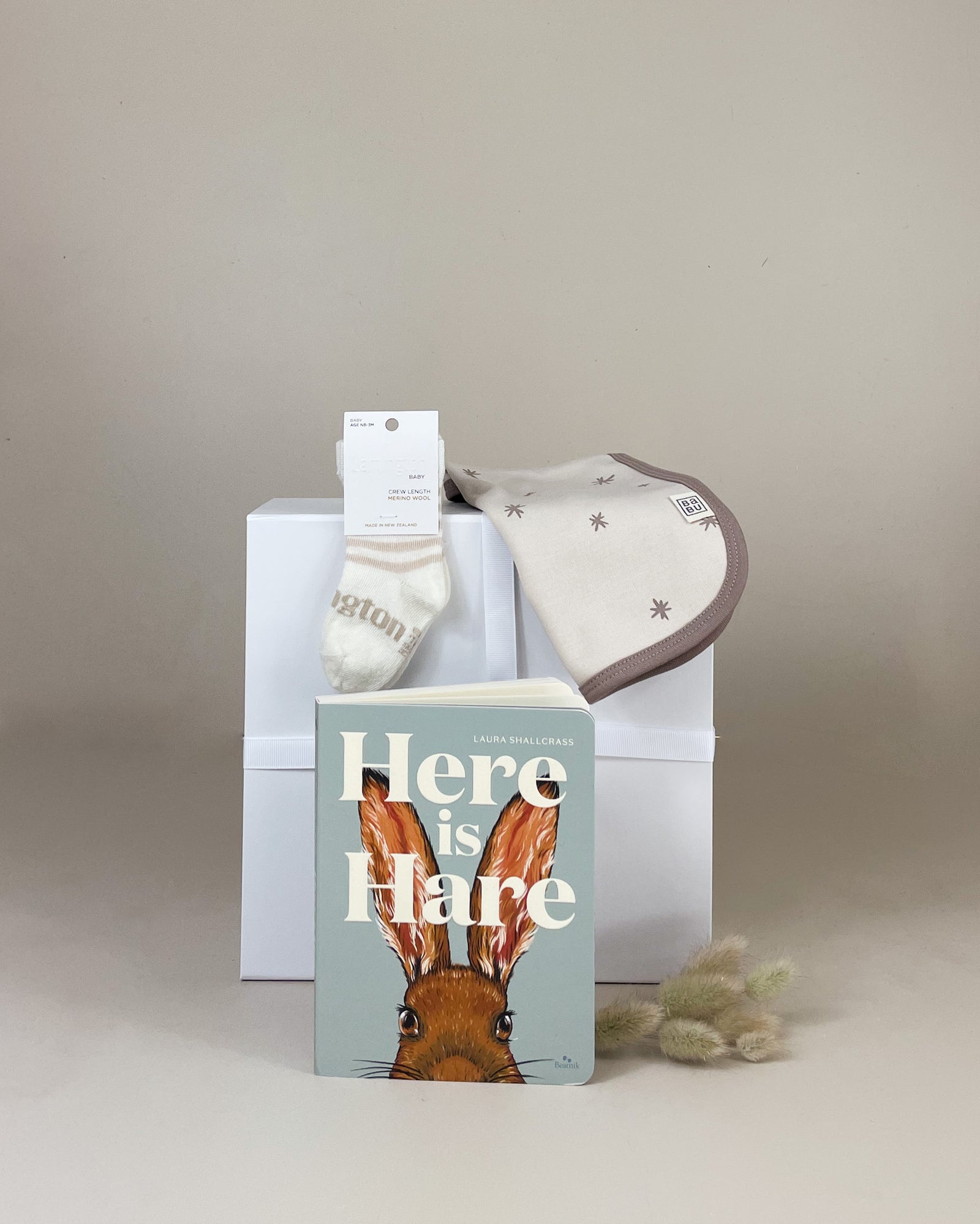 Newborn Keepsake Baby Gift Box NZ with rabbit baby book, bib, and choice of merino socks or baby brush, beautifully presented newborn gift set