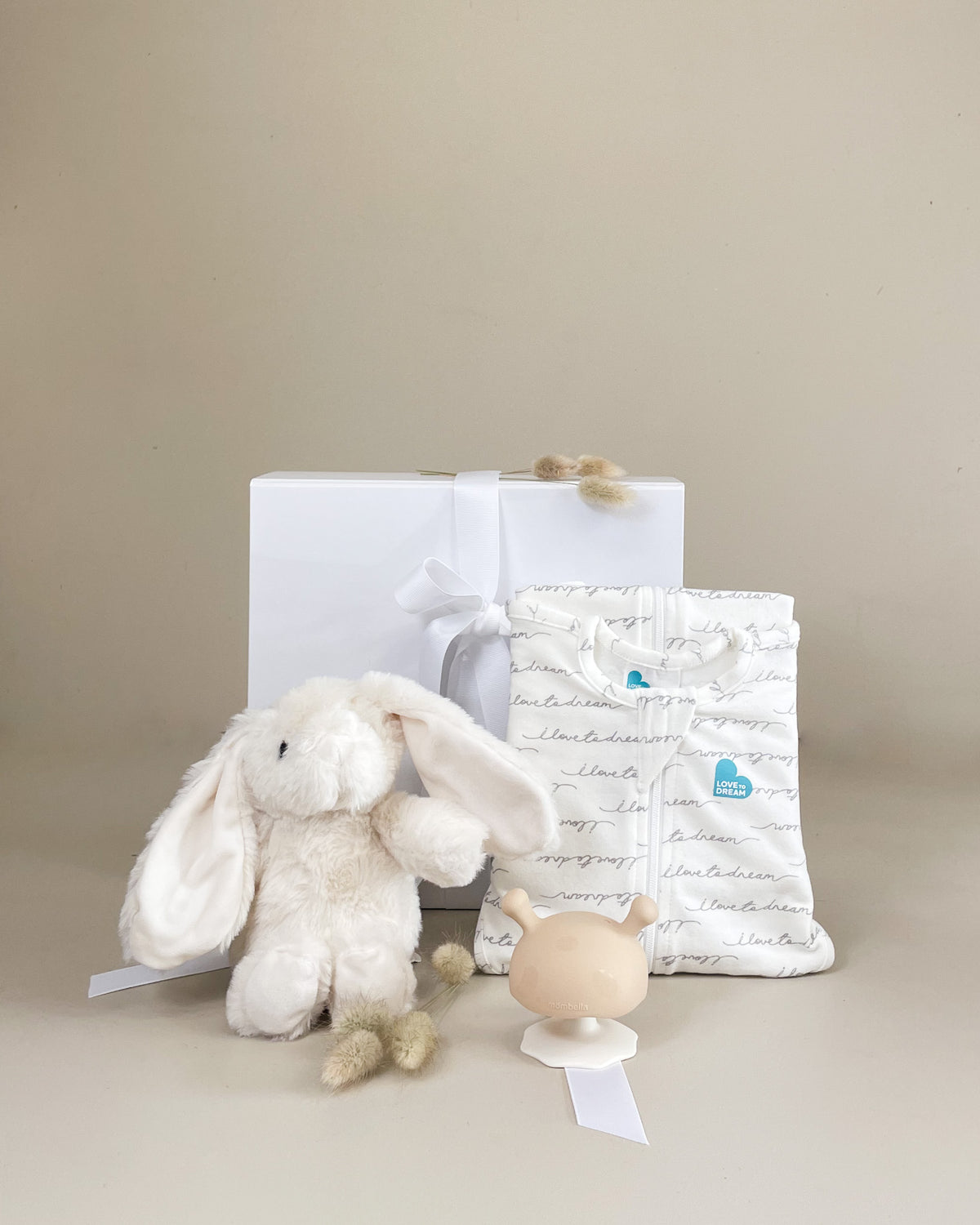 Newborn Love Gift Box with Love to Dream Swaddle UP, soft bunny and baby teether for a precious new arrival.