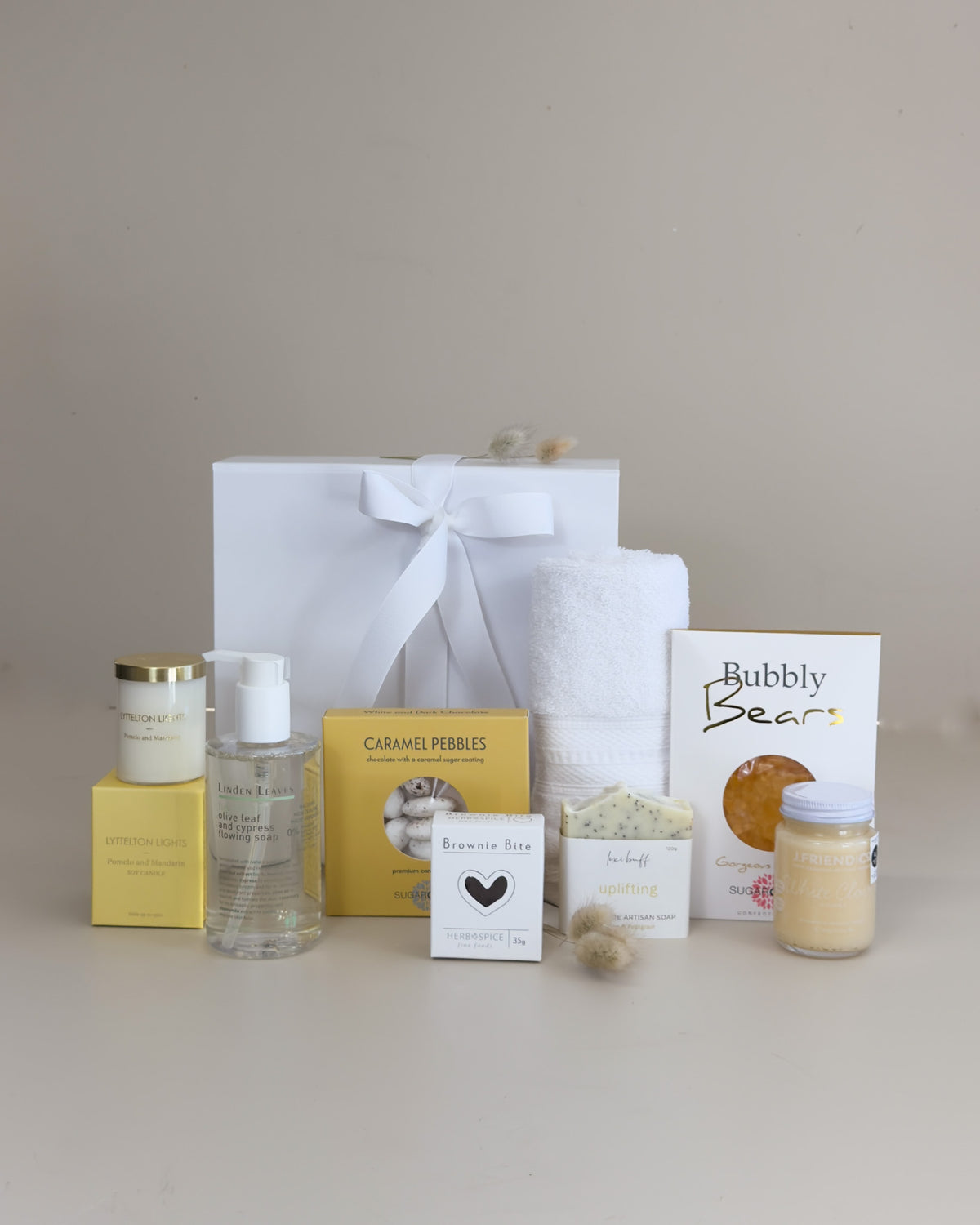 New Zealand gift box with flowing soap candle and tasty treats for thoughtful gifting



