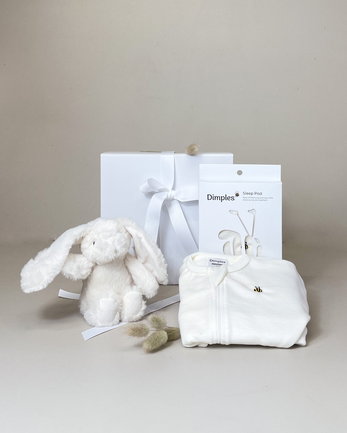 Sleeping Baby Gift Box with Dimples Merino Sleep Pod and cuddly lamb, beautifully presented for a newborn baby gift