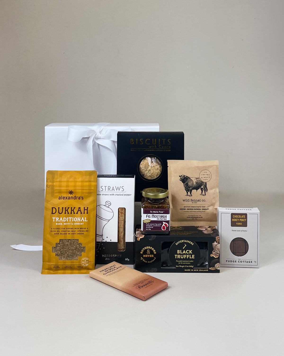 Spoil Him Artisan NZ Food Gift Box filled with premium New Zealand chocolate, gourmet savoury treats and artisan foods presented in a luxury white gift box.