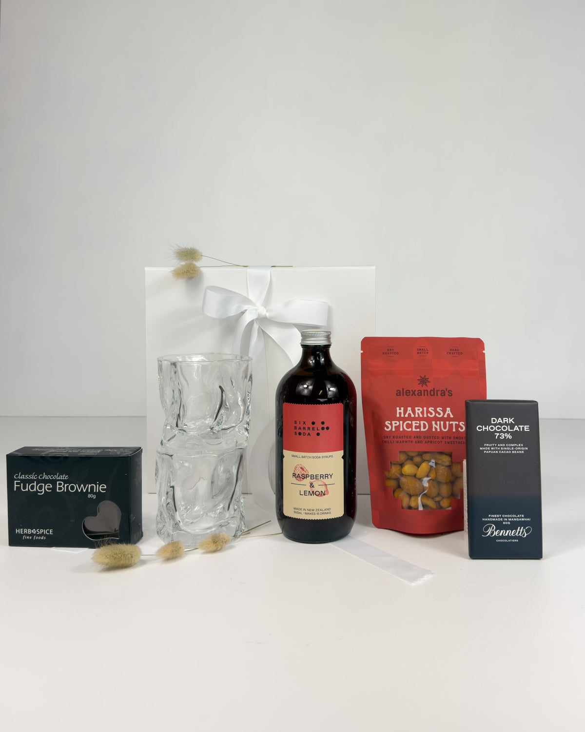 Non-alcoholic gift box with soda, Ned Collections tumblers, chocolate and brownie.