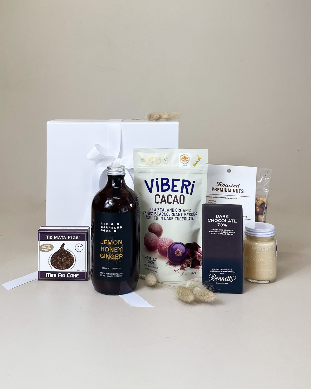 Wellness Food Gift Box with New Zealand honey lemon syrup, fig, blackcurrant treats and dark chocolate.