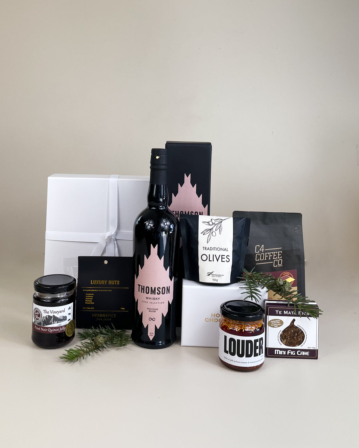 Thomson Two Tone Whisky Indulgence Gift Box with chilli oil, coffee chocolate and chocolate-coated nuts.