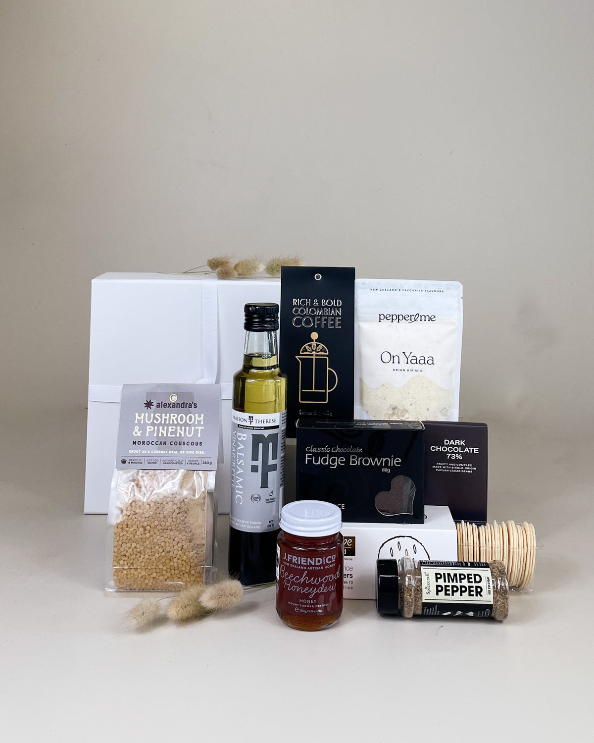 Winter Artisan Treats Gift Box with artisan honey, dark chocolate, balsamic vinegar, mushroom couscous, and gourmet New Zealand food beautifully presented for gifting.
