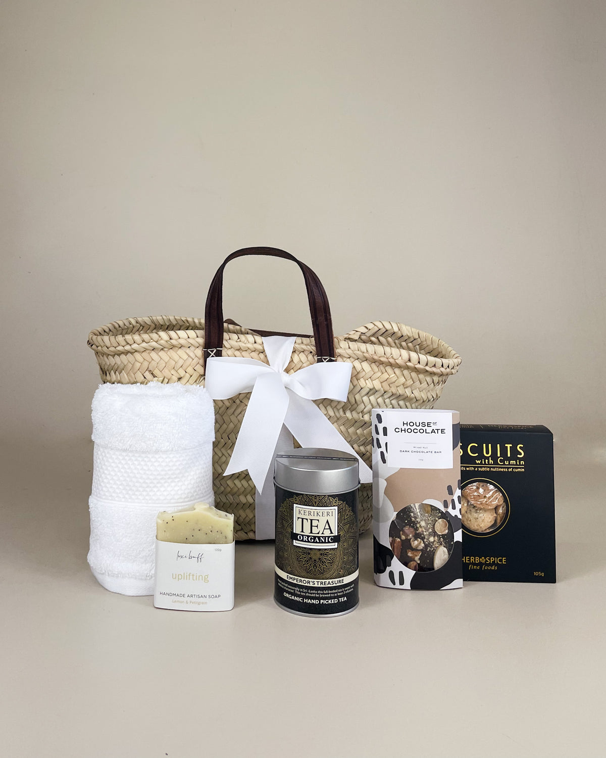 You Deserve It luxury NZ gift basket featuring premium tea, artisan cookies, handmade chocolate and natural body soap in an elegant self-care gift box.